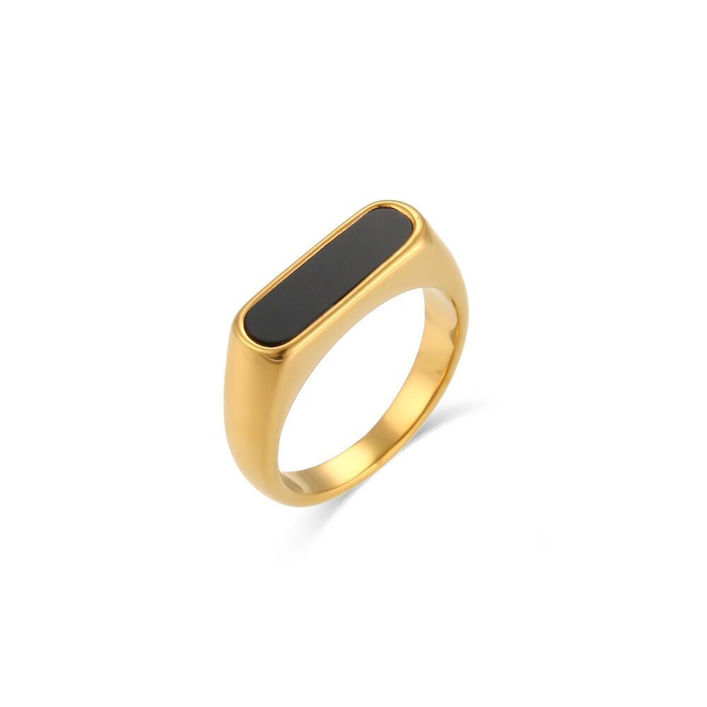 Gold Black Signet Ring with an elongated black inlay, front view on white